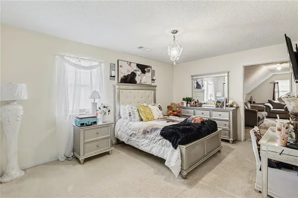 a living room with furniture and a large mirror
