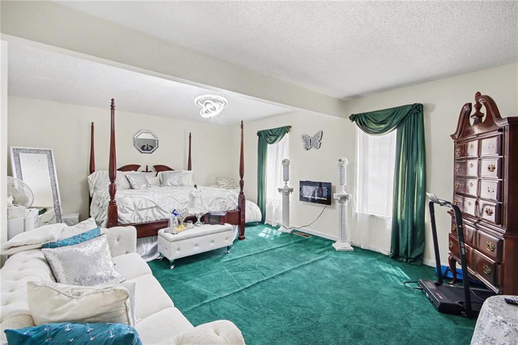 60 Post Oak Trace Villa Rica, GA 30180 - Photo 20 of 34 a living room with furniture and a large mirror