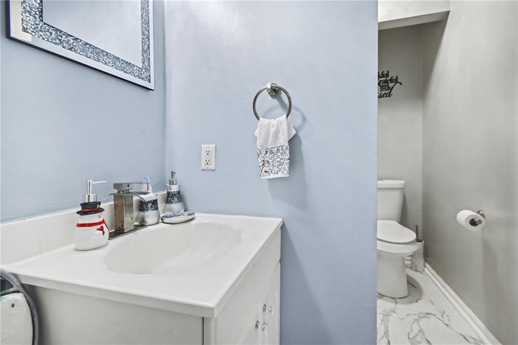 60 Post Oak Trace Villa Rica, GA 30180 - Photo 21 of 34 a bathroom with a toilet sink and mirror