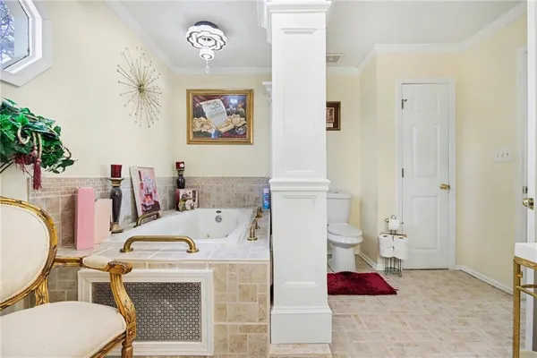 a bathroom with a sink a toilet and a shower curtain