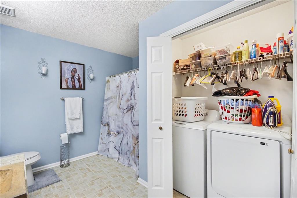60 Post Oak Trace Villa Rica, GA 30180 - Photo 31 of 34 a storage room with washer and dryer