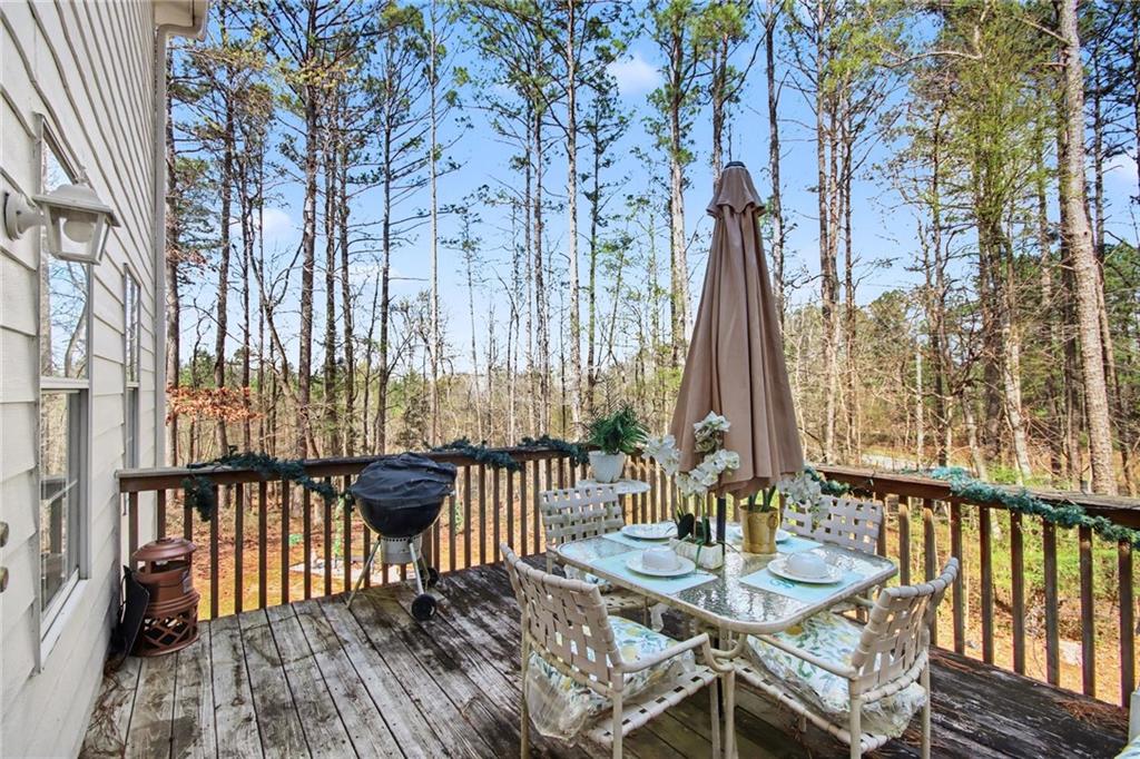 60 Post Oak Trace Villa Rica, GA 30180 - Photo 32 of 34 a view of balcony with wooden floor and outdoor seating