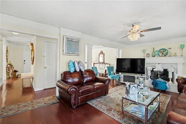 a living room with furniture and a flat screen tv