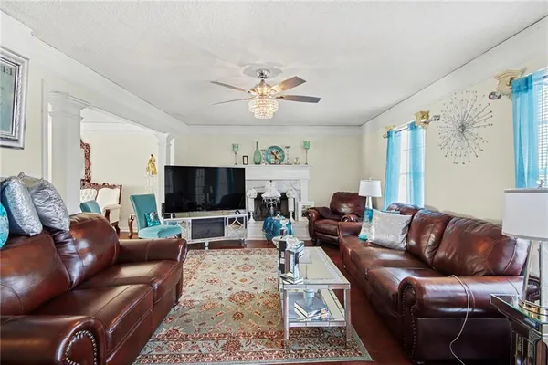 a living room with furniture and a flat screen tv