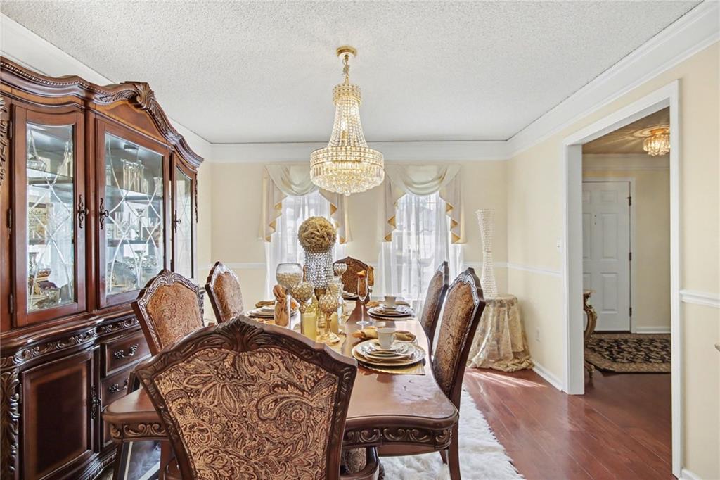 60 Post Oak Trace Villa Rica, GA 30180 - Photo 10 of 34 a view of a dining room with furniture window and wooden floor