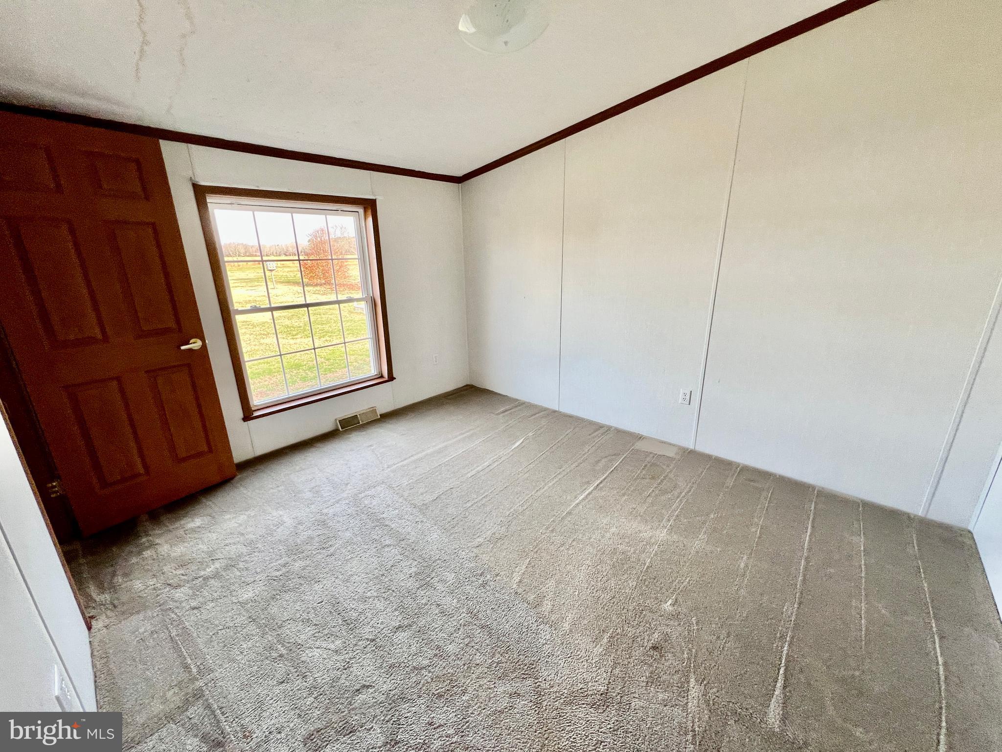 16583 Laurel Road Laurel, DE 19956 - Photo 16 of 34 a view of an empty room with a window
