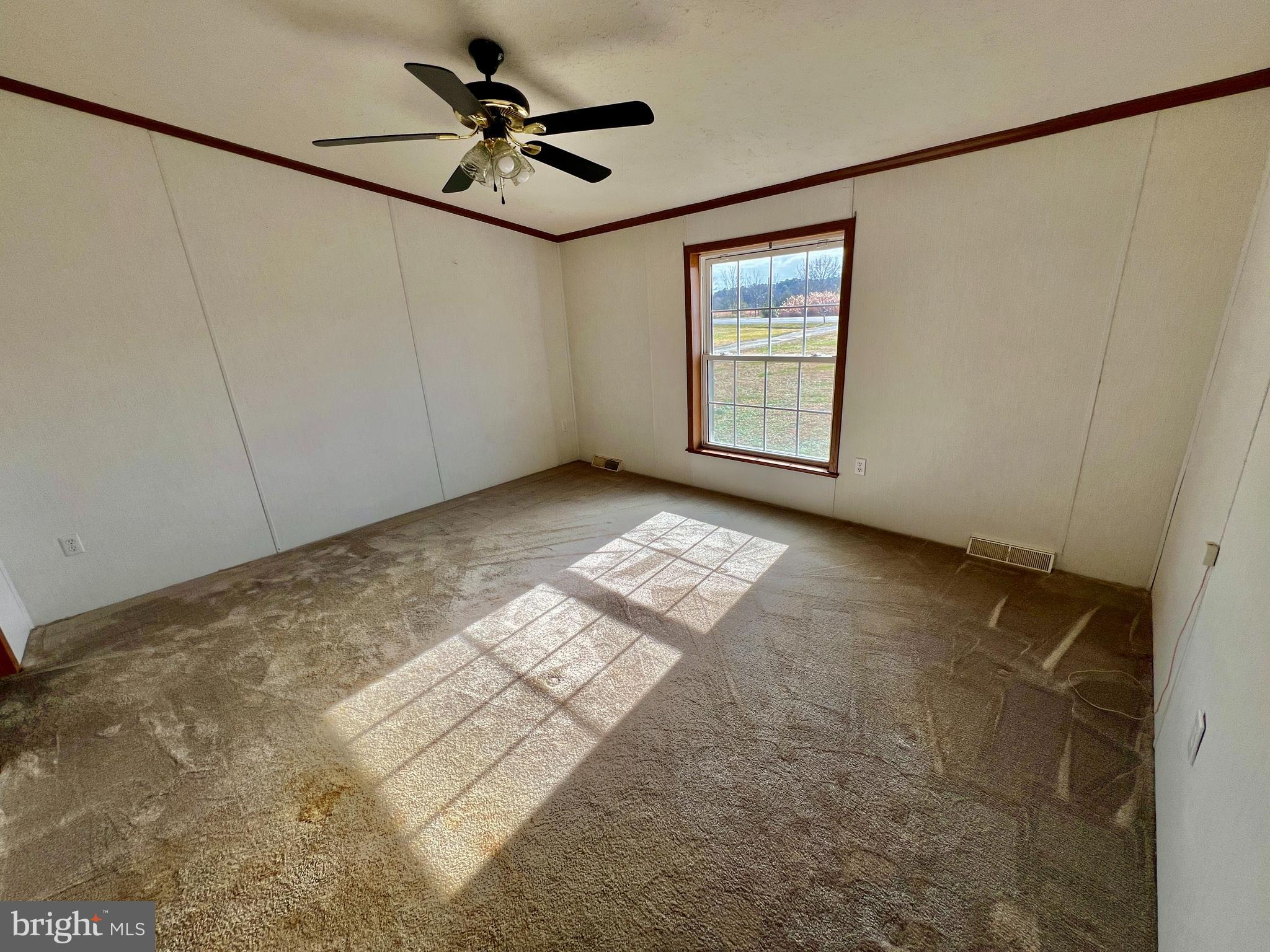 16583 Laurel Road Laurel, DE 19956 - Photo 20 of 34 a view of a livingroom with a ceiling fan and window