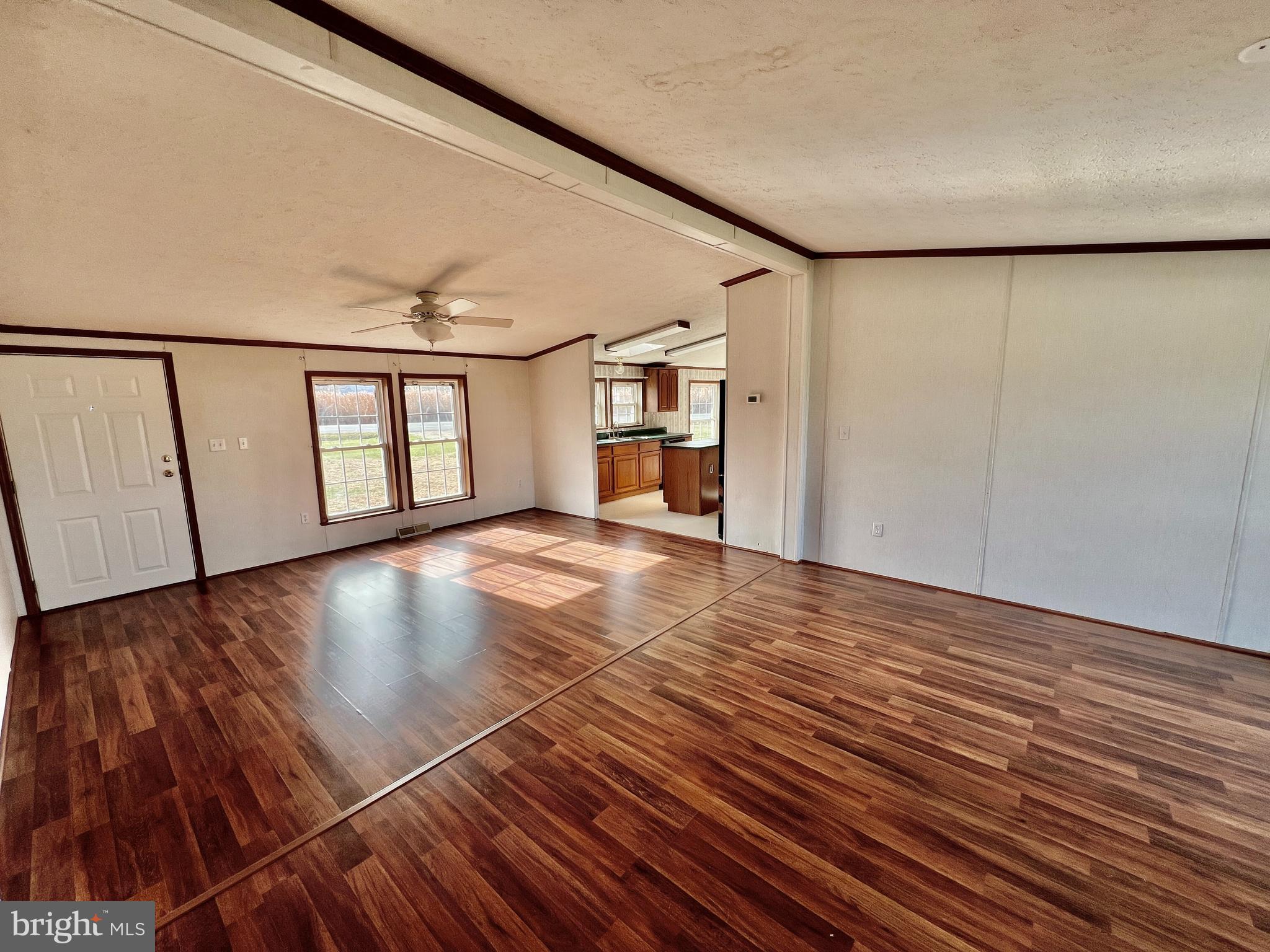 16583 Laurel Road Laurel, DE 19956 - Photo 4 of 34 a view of an empty room with window and wooden floor