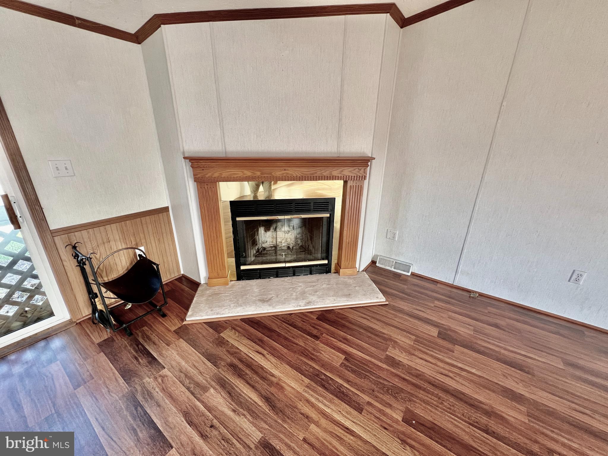 16583 Laurel Road Laurel, DE 19956 - Photo 7 of 34 a living room with furniture and a fireplace
