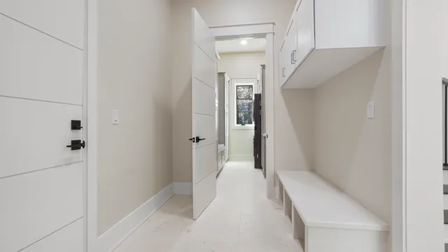 a view of a hallway with a white walls