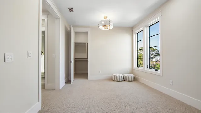 a bed room with a bed and a dresser