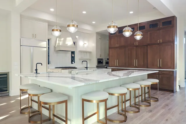 a kitchen with a table and chairs in it