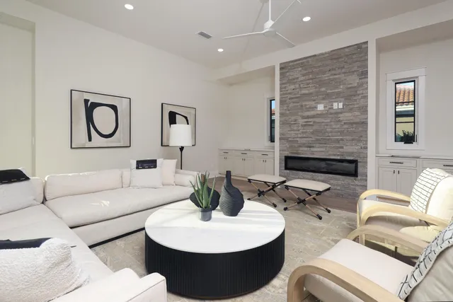 a living room with furniture and a fireplace