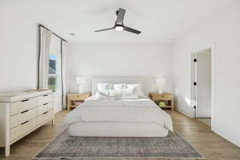 a large white bed in a white room