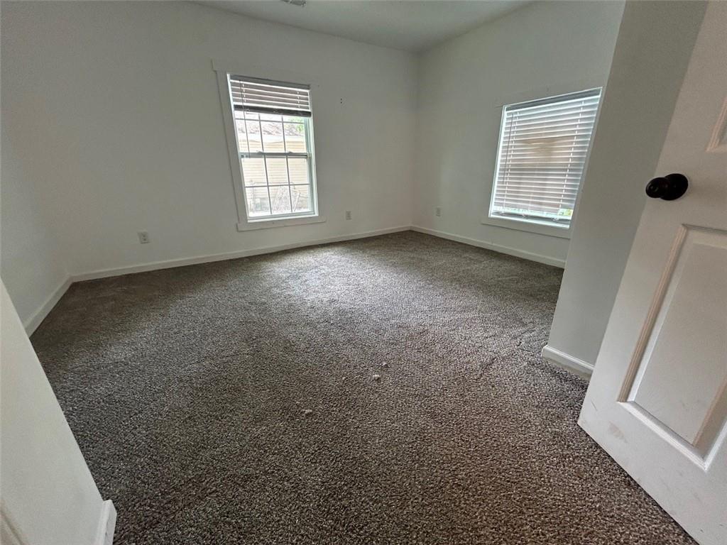 4495 Calhoun Road Northeast Rome, GA 30161 - Photo 12 of 14 an empty room with windows