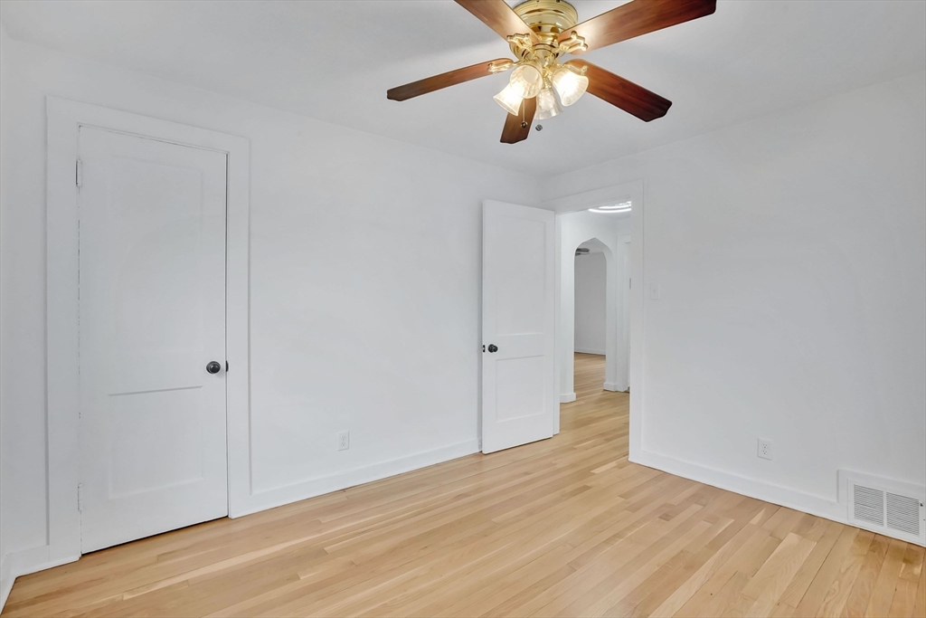 155 Powell Avenue Springfield, MA 01118 - Photo 16 of 41 wooden floor in an empty room