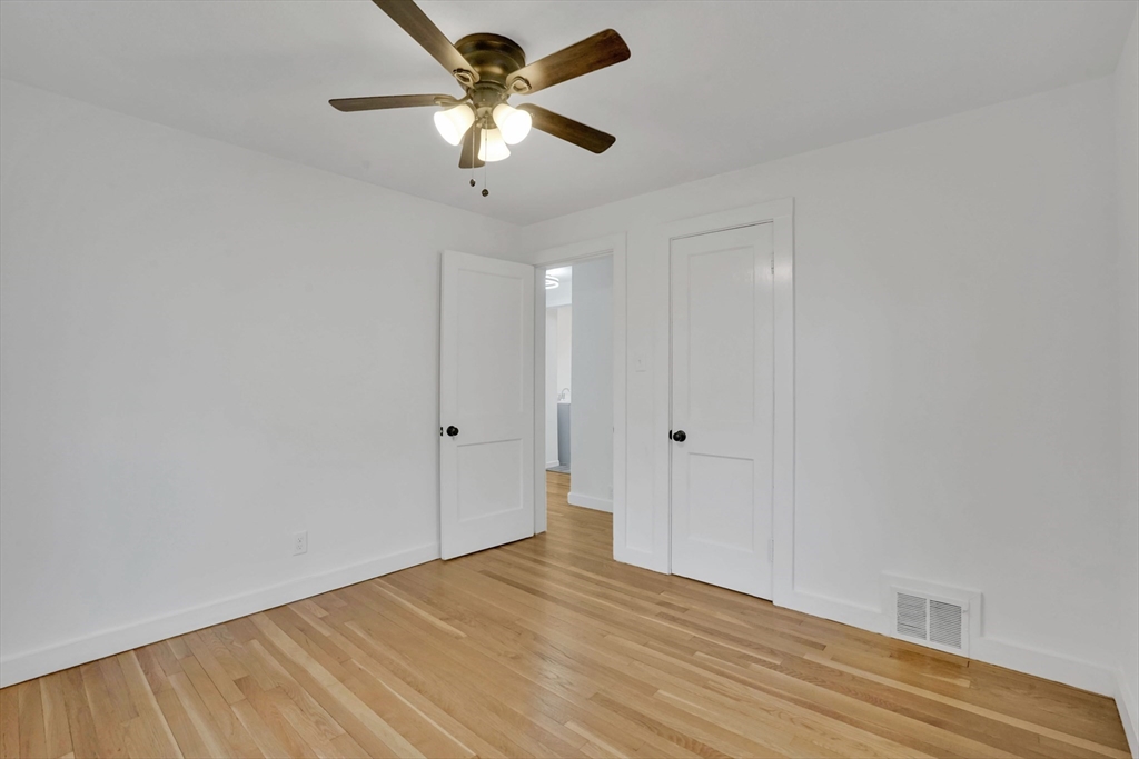 155 Powell Avenue Springfield, MA 01118 - Photo 18 of 41 wooden floor in an empty room