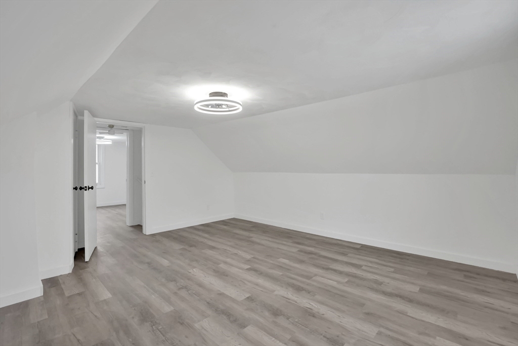 155 Powell Avenue Springfield, MA 01118 - Photo 19 of 41 a view of empty room with wooden floor