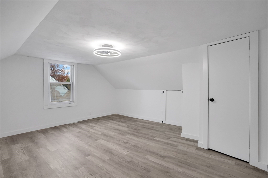 155 Powell Avenue Springfield, MA 01118 - Photo 20 of 41 a view of empty room with wooden floor