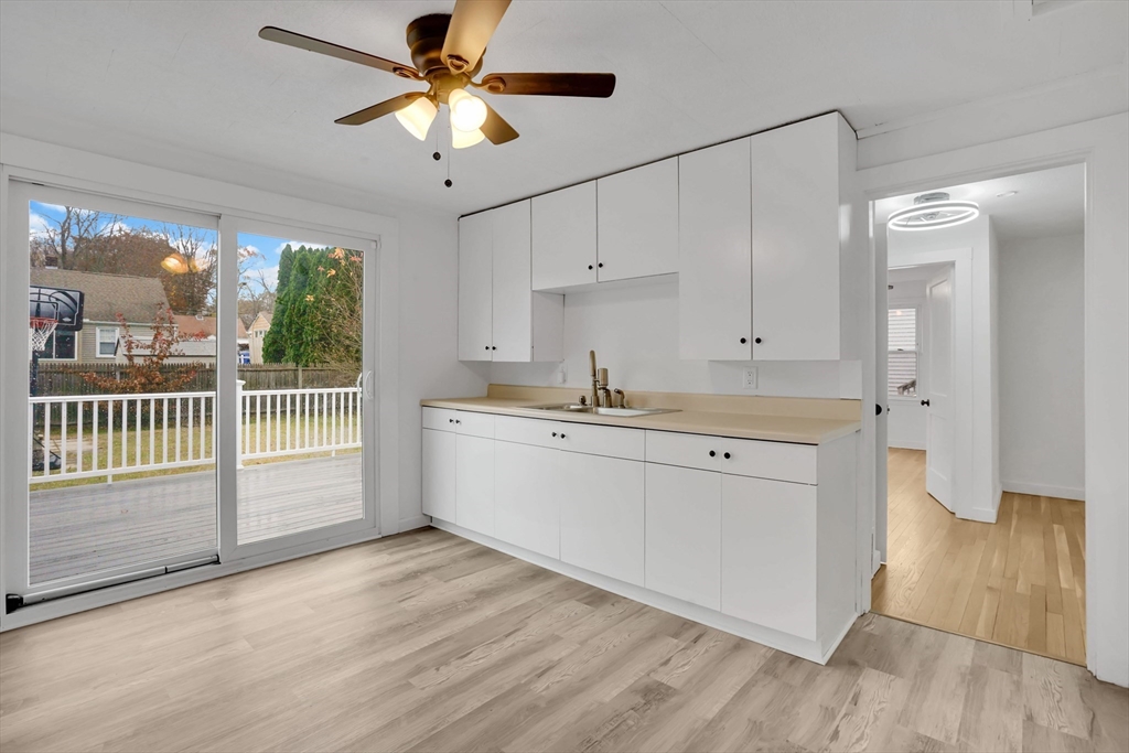 155 Powell Avenue Springfield, MA 01118 - Photo 3 of 41 a kitchen with a sink cabinets and wooden floor