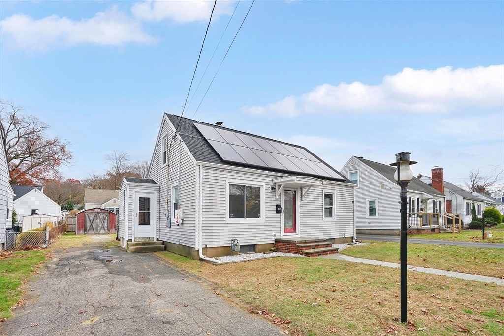 155 Powell Avenue Springfield, MA 01118 - Photo 35 of 41 a view of a white house next to a yard with wooden fence