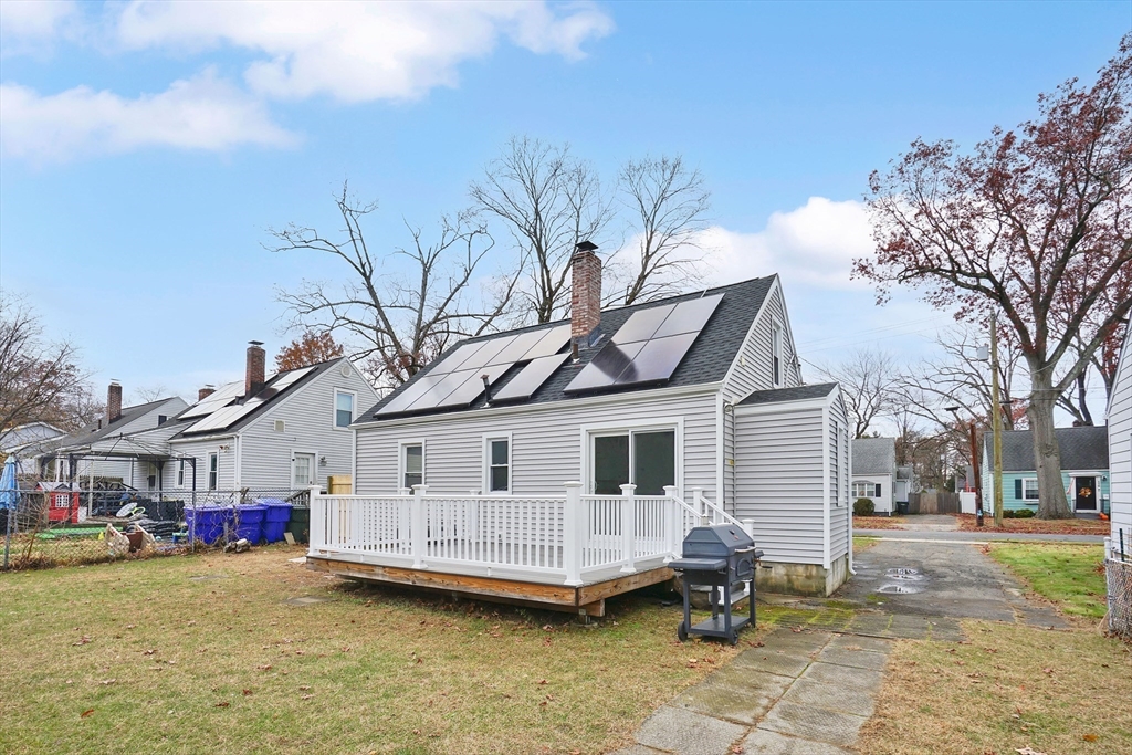 155 Powell Avenue Springfield, MA 01118 - Photo 36 of 41 a view of a white house with a large windows and a yard with a fountain