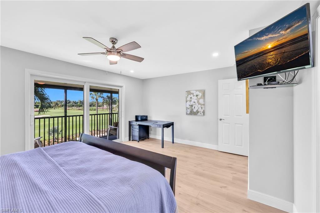 138 Teryl Road, Unit 42 Naples, FL 34112 - Photo 16 of 34 a bedroom with a bed and a flat screen tv