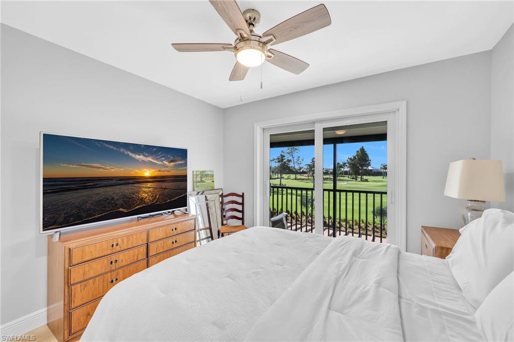 138 Teryl Road, Unit 42 Naples, FL 34112 - Photo 19 of 34 a bedroom with a bed and a flat screen tv