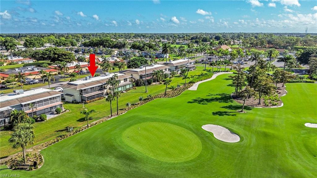 138 Teryl Road, Unit 42 Naples, FL 34112 - Photo 30 of 34 a view of a golf course with a swimming pool