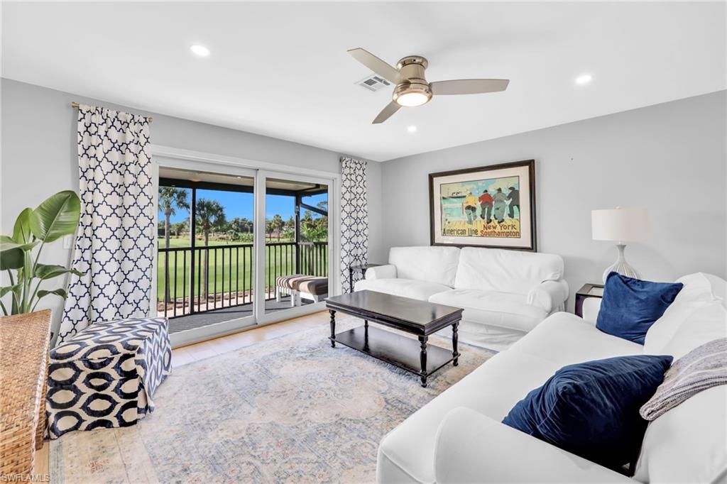 138 Teryl Road, Unit 42 Naples, FL 34112 - Photo 5 of 34 a living room with furniture and a floor to ceiling window