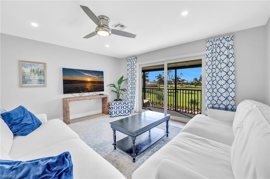 138 Teryl Road, Unit 42 Naples, FL 34112 - Photo 6 of 34 a living room with furniture and a flat screen tv