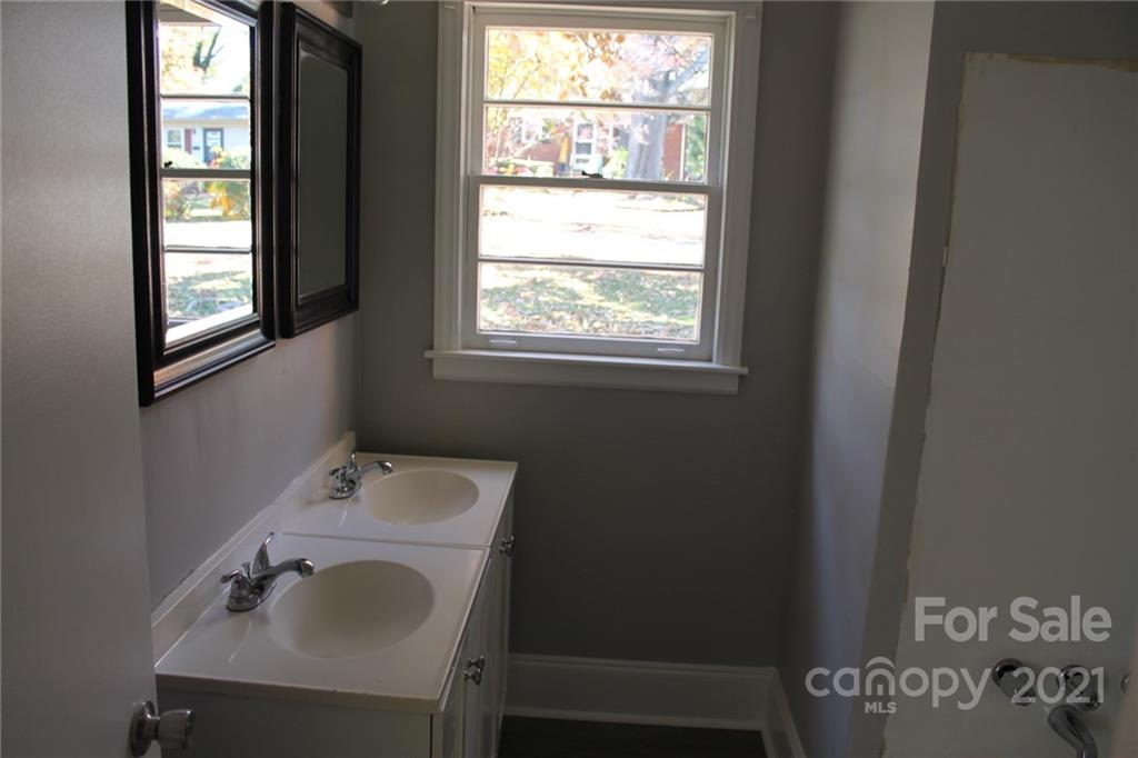 4322 Tillman Road Charlotte, NC 28208 - Photo 12 of 20 a bathroom with a sink and a window
