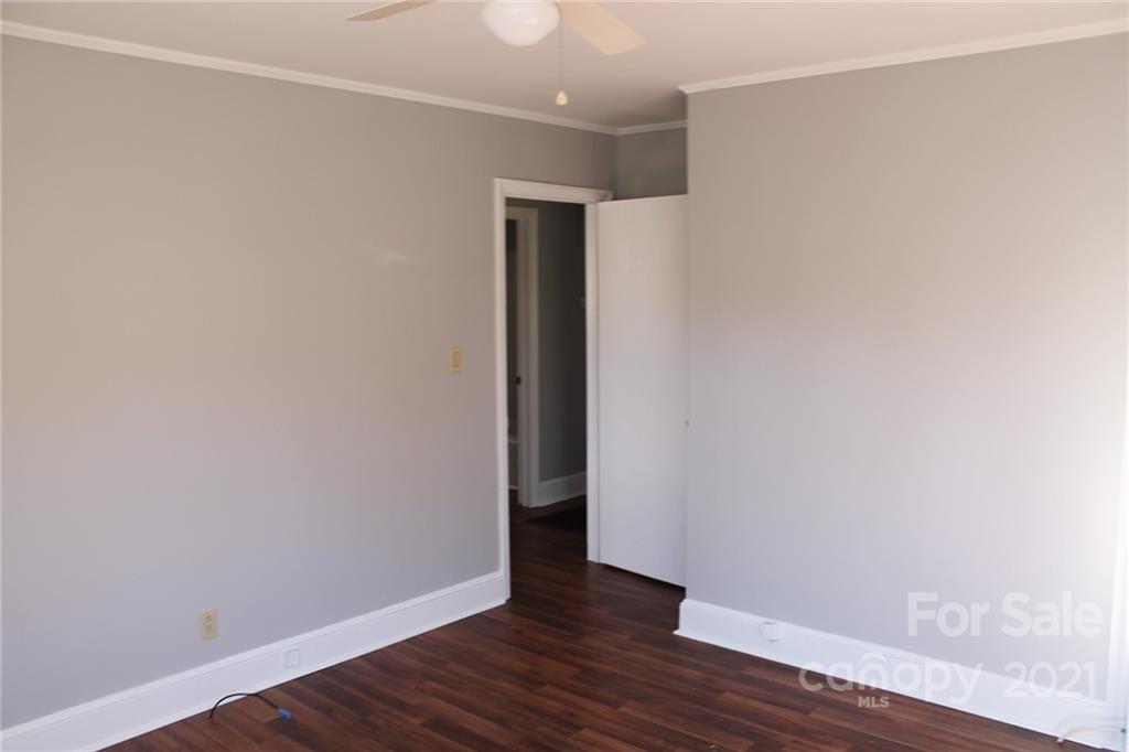 4322 Tillman Road Charlotte, NC 28208 - Photo 16 of 20 a view of an empty room with wooden floor