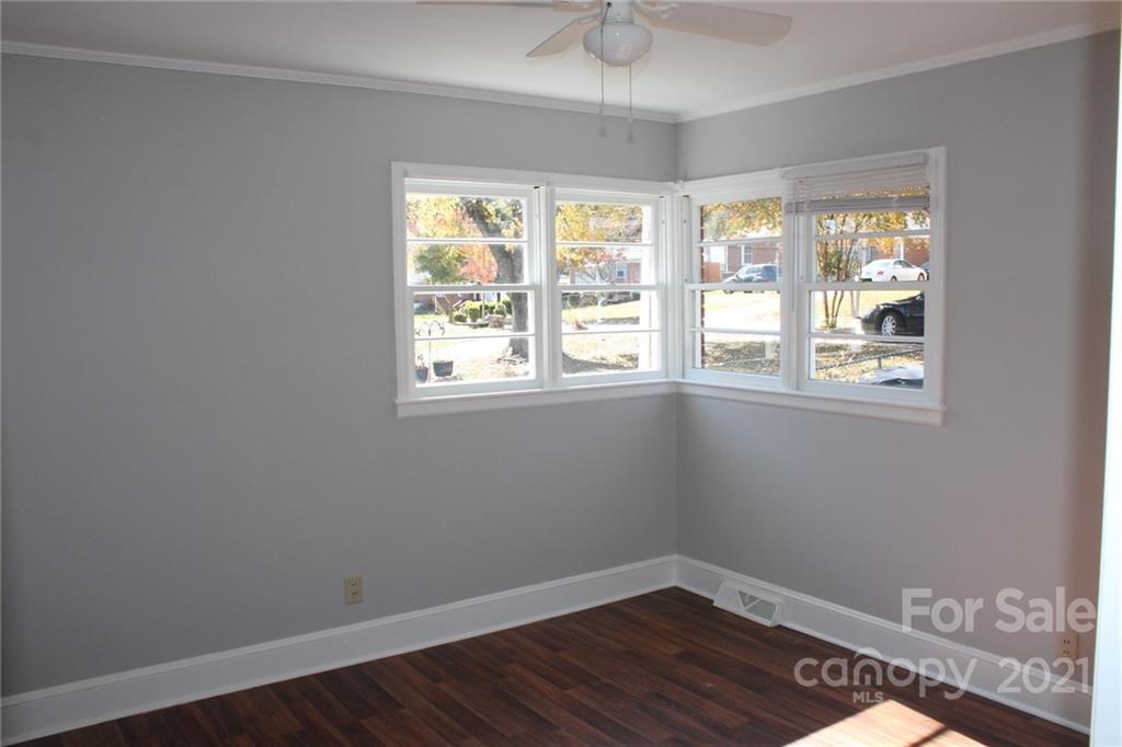 4322 Tillman Road Charlotte, NC 28208 - Photo 17 of 20 a view of an empty room with wooden floor and a window