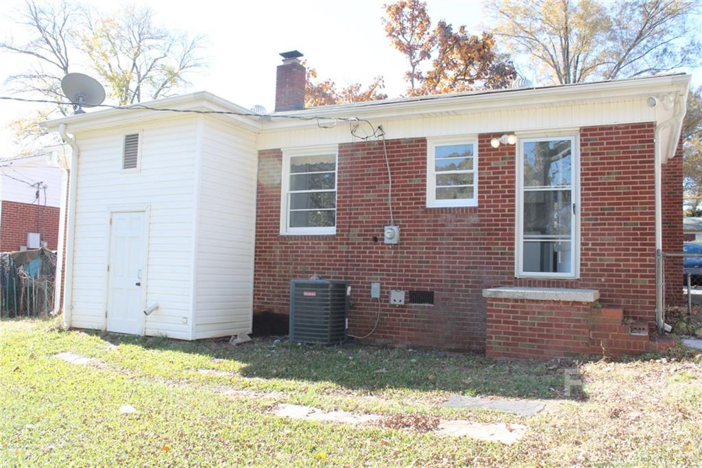 4322 Tillman Road Charlotte, NC 28208 - Photo 20 of 20 a view of a house with a yard and garage
