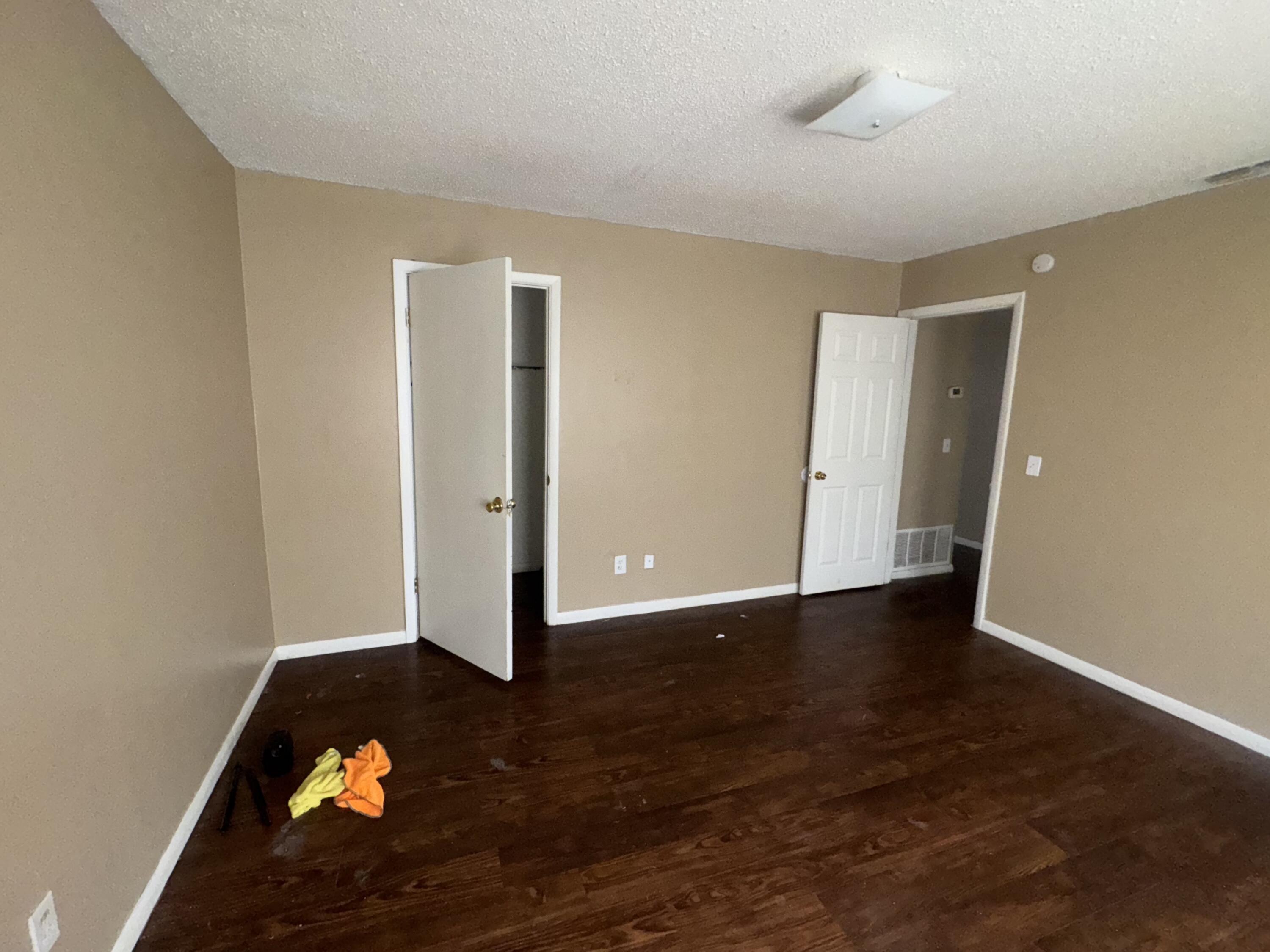 100 Pecos Place Plainview, TX 79072 - Photo 18 of 28 a view of an empty room and wooden floor
