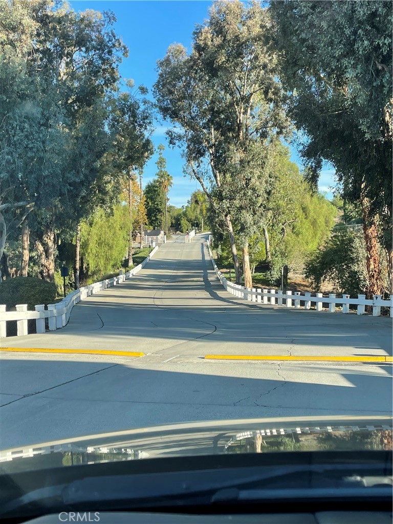 15181 Van Buren Boulevard, Unit 99 Riverside, CA 92504 - Photo 11 of 12 a view of swimming pool with an outdoor space and seating area