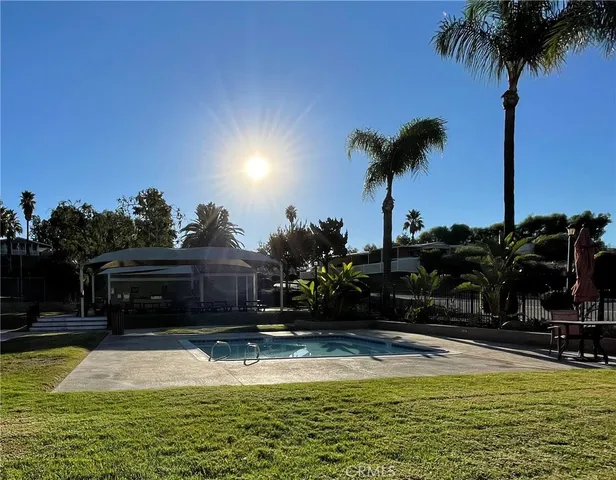 a view of a swimming pool with a garden