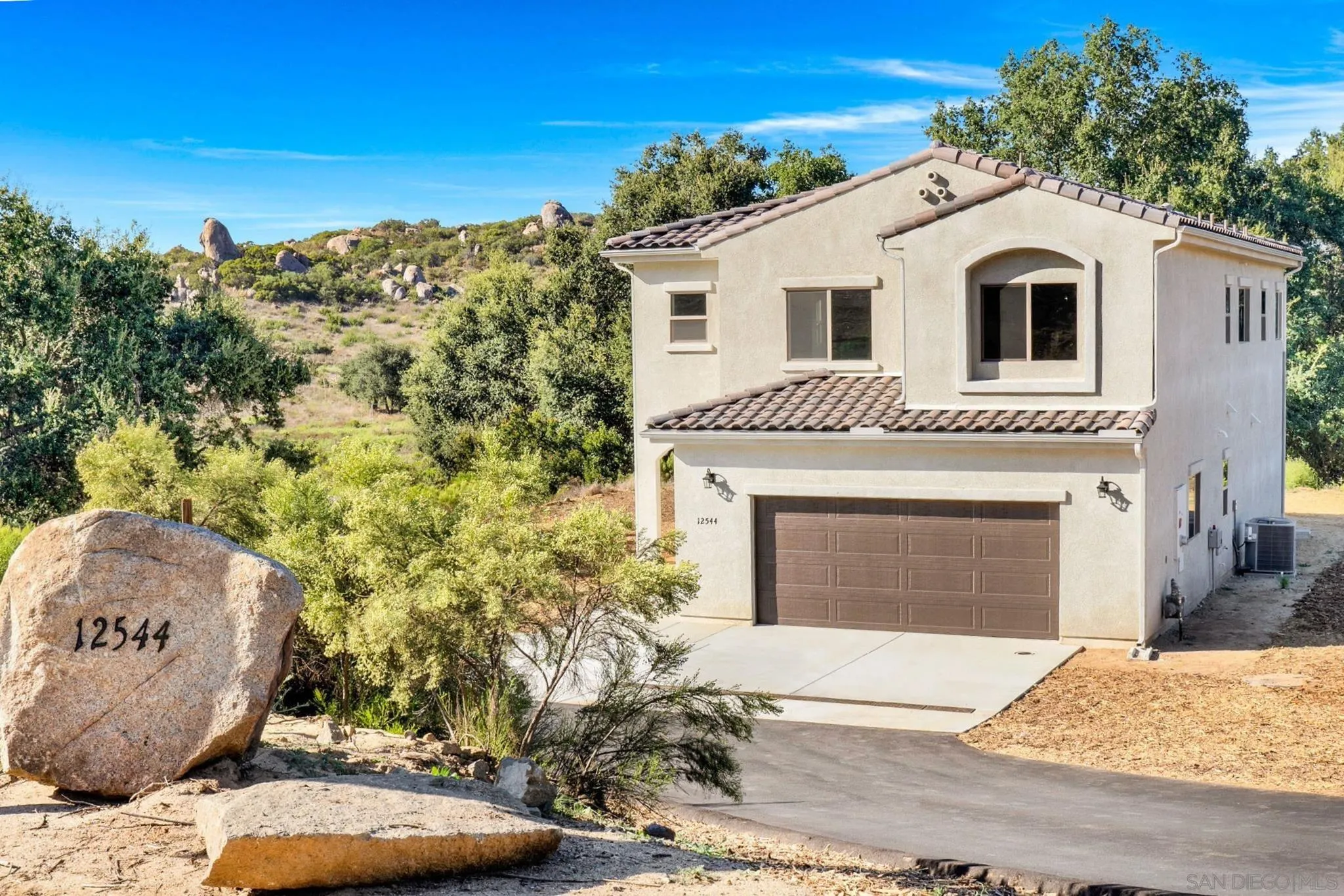 12544 Via Vigneto Lakeside, CA 92040 - Photo 1 of 30 a front view of a house with a yard