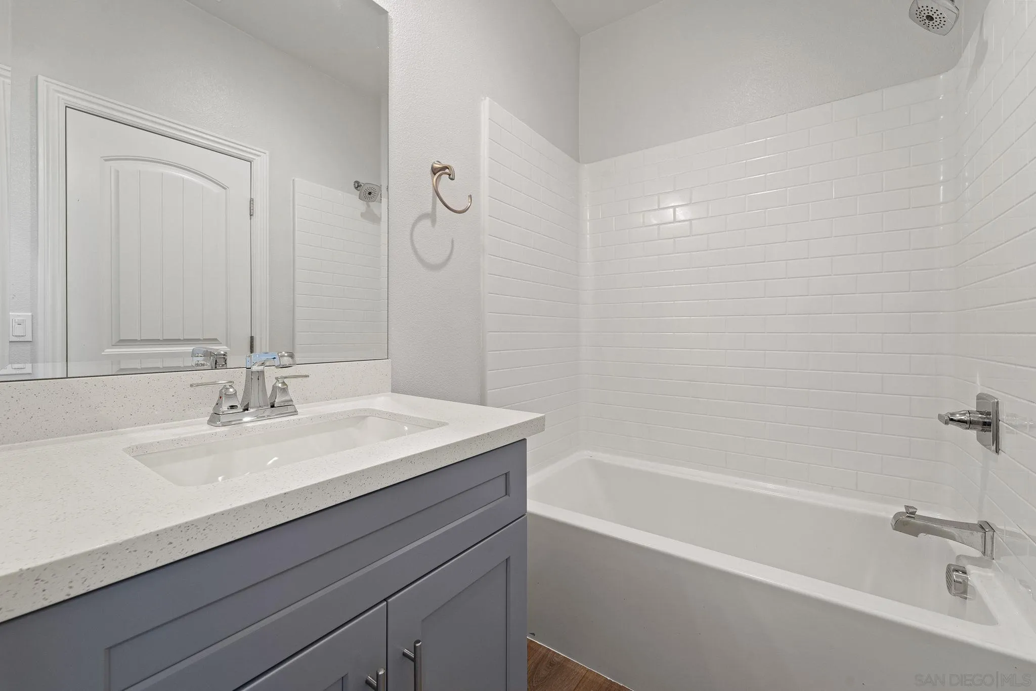 12544 Via Vigneto Lakeside, CA 92040 - Photo 19 of 30 a bathroom with a sink a mirror and a bathtub