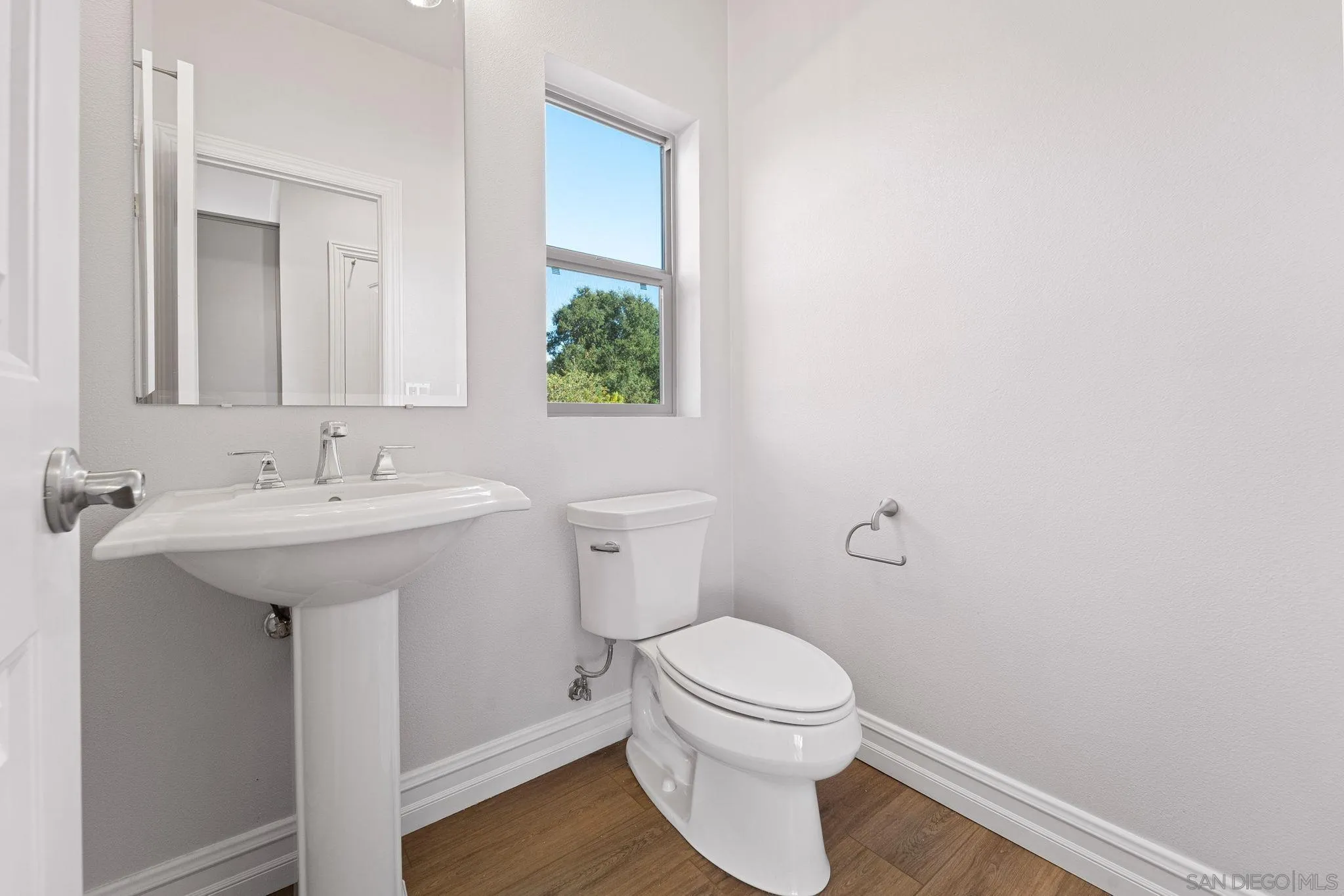 12544 Via Vigneto Lakeside, CA 92040 - Photo 21 of 30 a bathroom with a sink toilet and a mirror