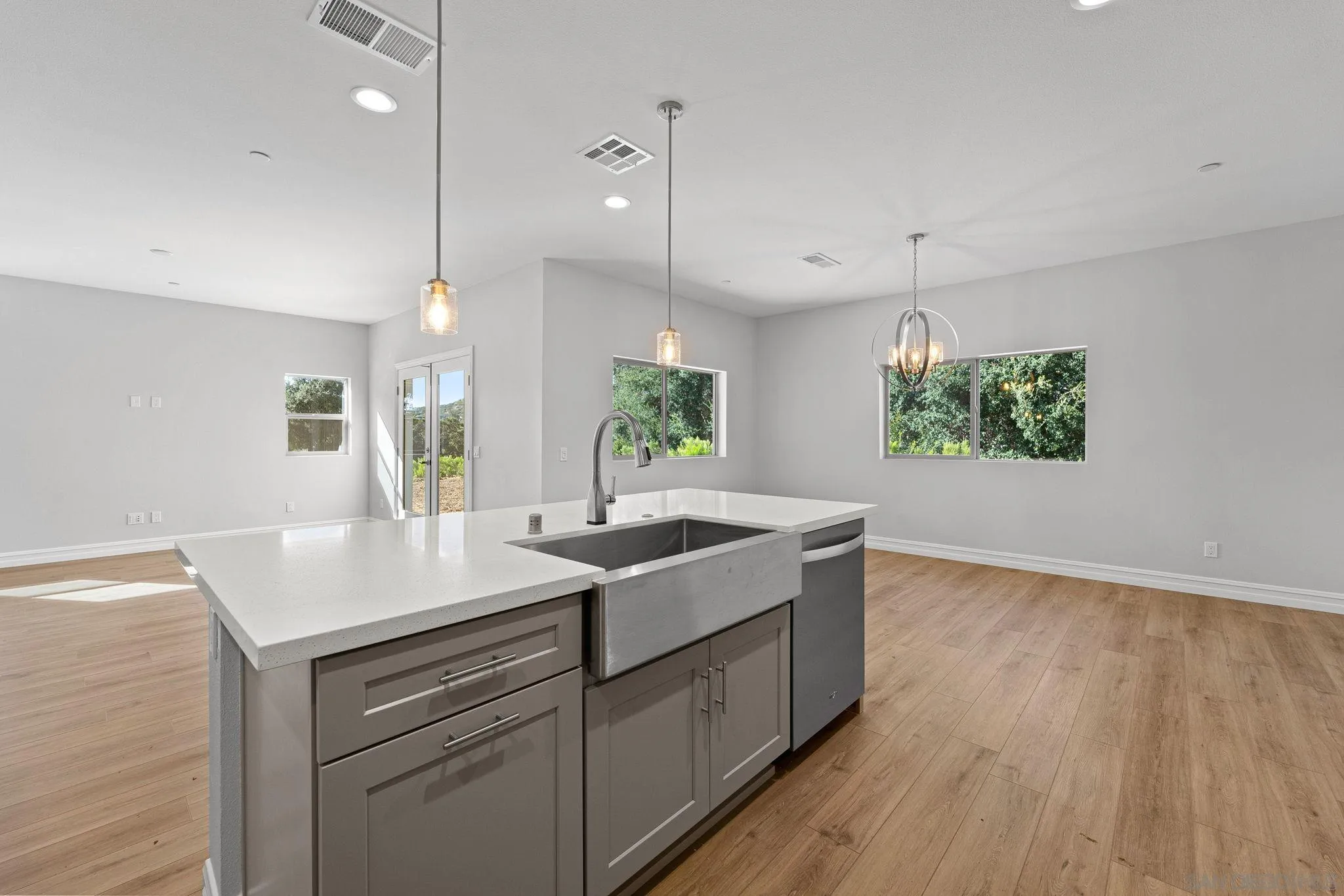 12544 Via Vigneto Lakeside, CA 92040 - Photo 6 of 30 a kitchen with a sink a counter space and wooden floor