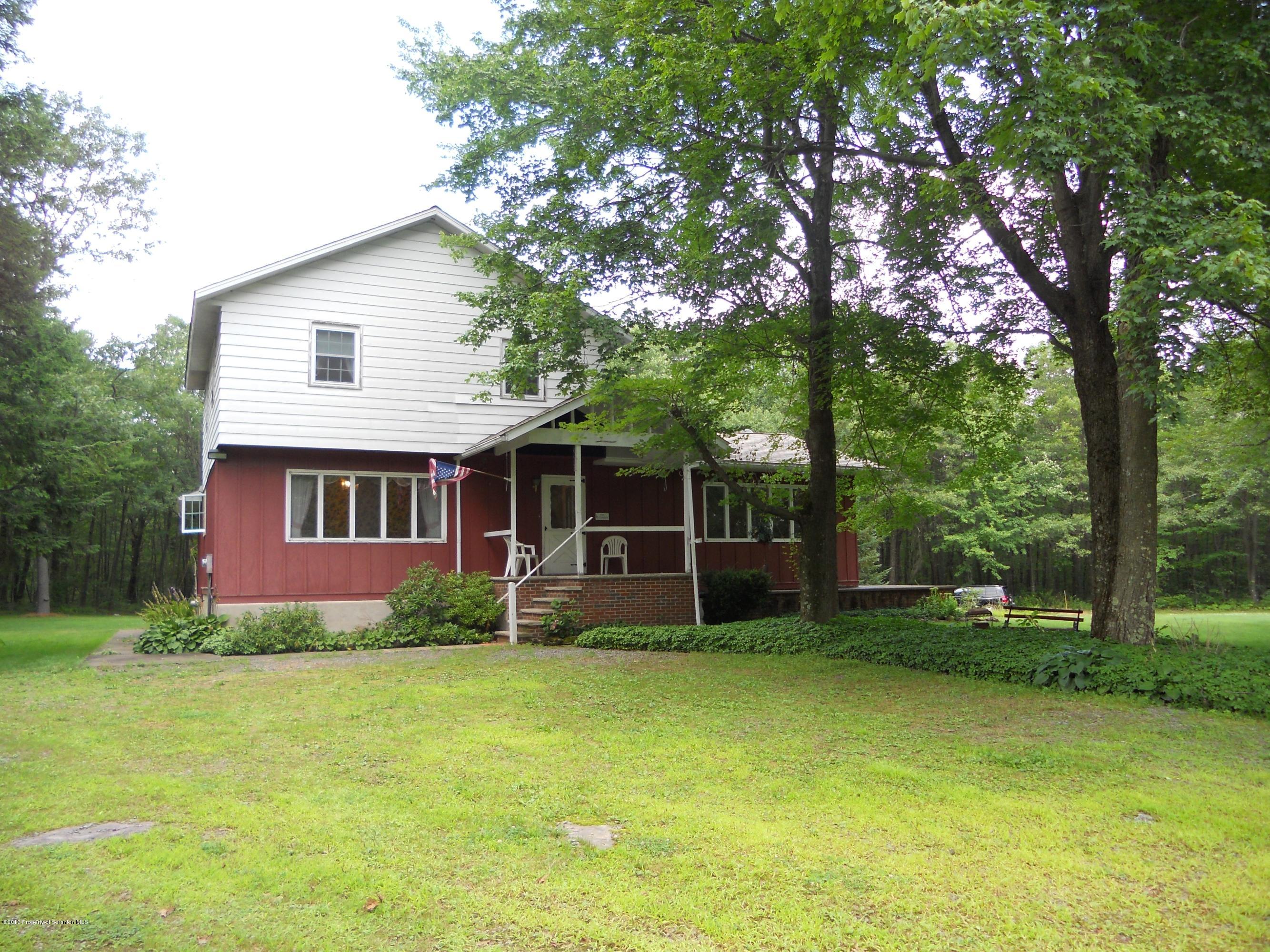 125 Fitzpatrick Road Lake Ariel, PA 18436 - Photo 1 of 61 a front view of a house with garden