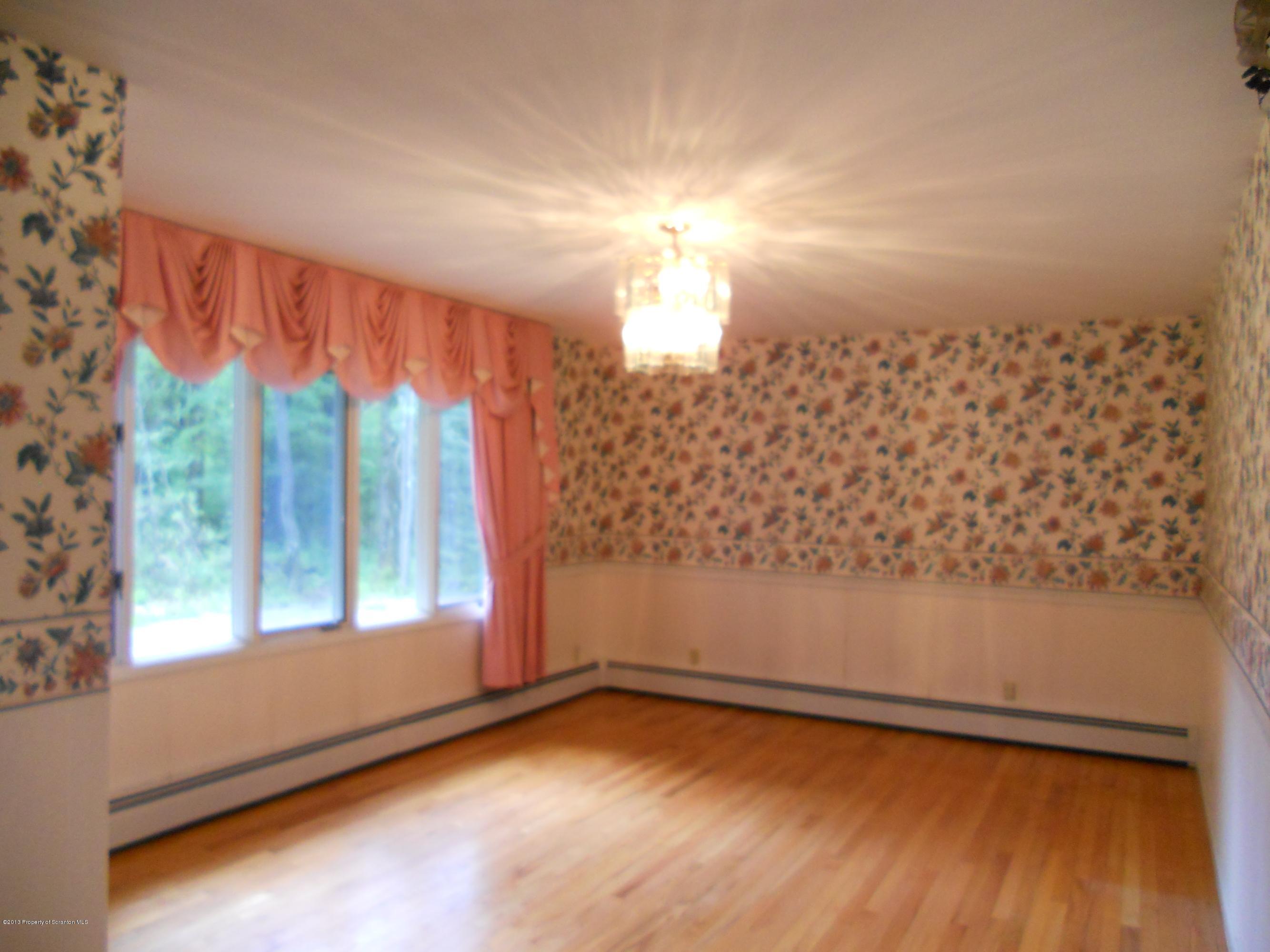 125 Fitzpatrick Road Lake Ariel, PA 18436 - Photo 11 of 61 a view of empty room with wooden floor and fan