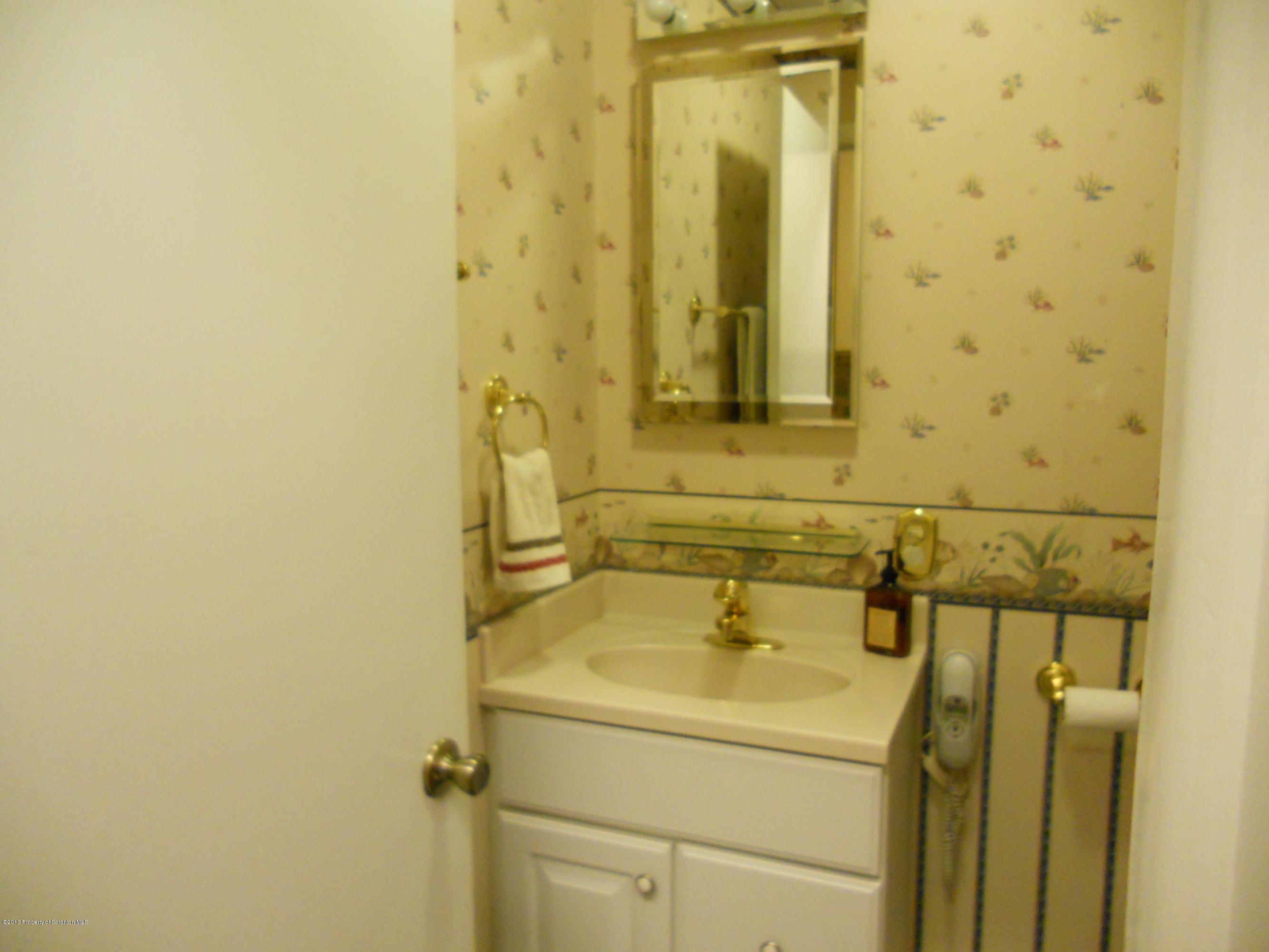 125 Fitzpatrick Road Lake Ariel, PA 18436 - Photo 21 of 61 a bathroom with a sink and a mirror