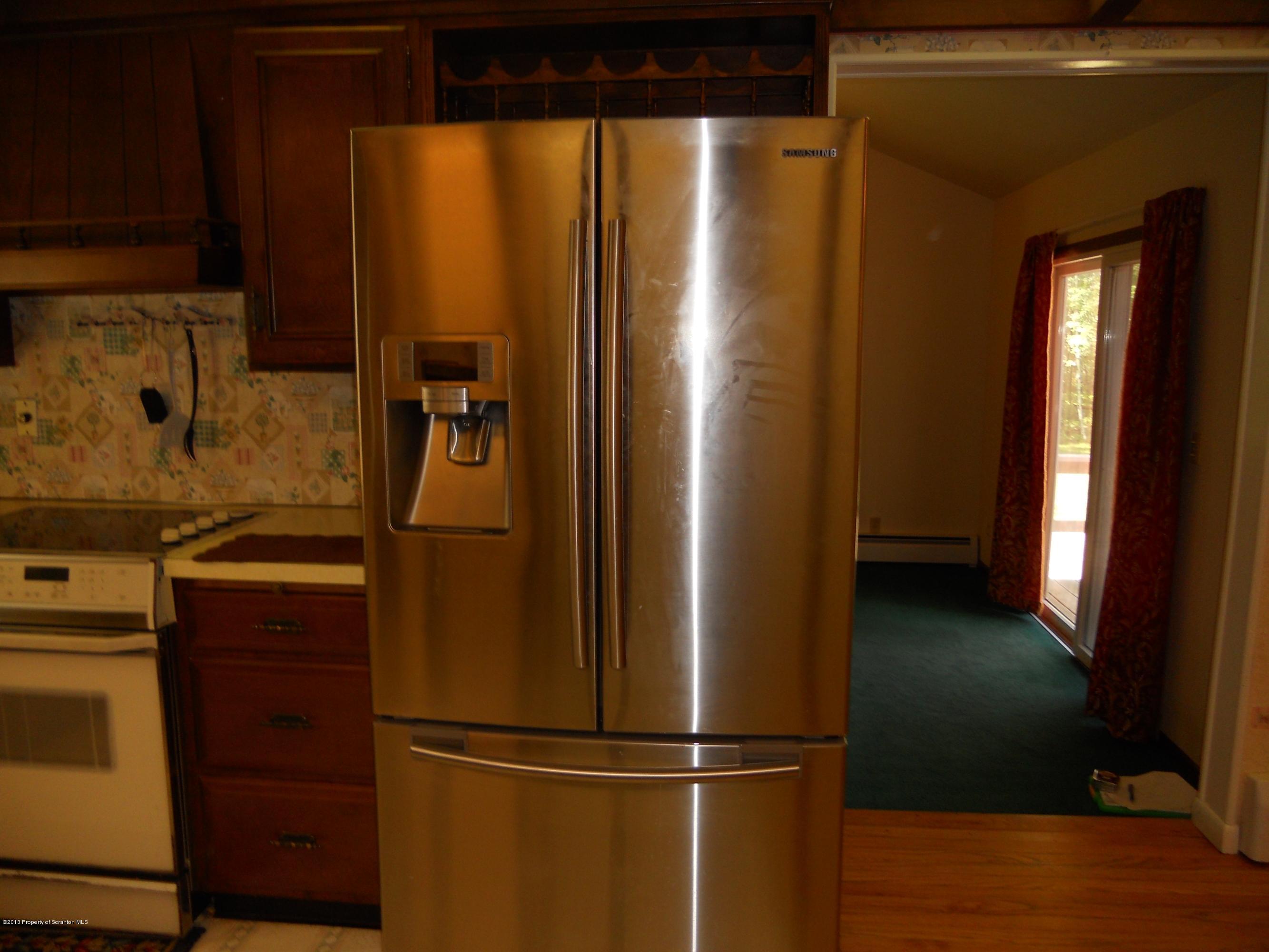125 Fitzpatrick Road Lake Ariel, PA 18436 - Photo 34 of 61 a metallic refrigerator freezer sitting in a kitchen