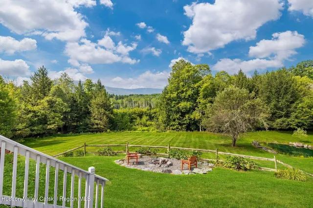 a view of a chair and table on the wooden floor
