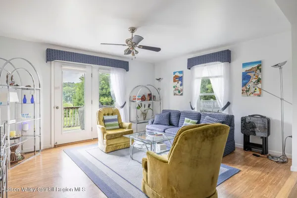 a view of a dining room with furniture window and wooden floor