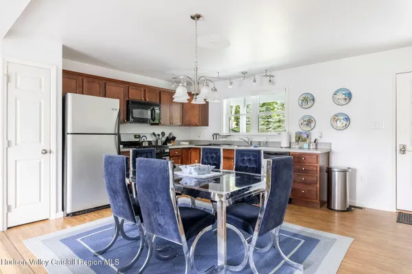 a large kitchen with stainless steel appliances granite countertop a sink and cabinets