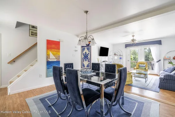 a living room with furniture and a book shelf